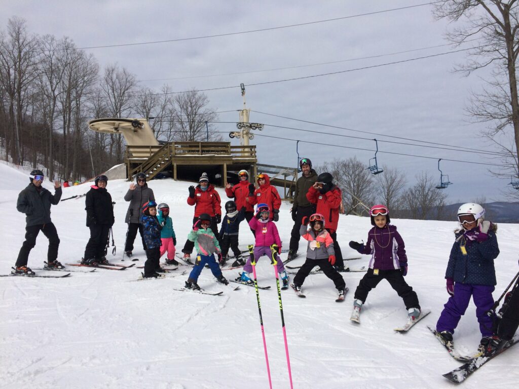 Group of kids taking a lesson with PSIA certified instructors at Bousquet Mountain