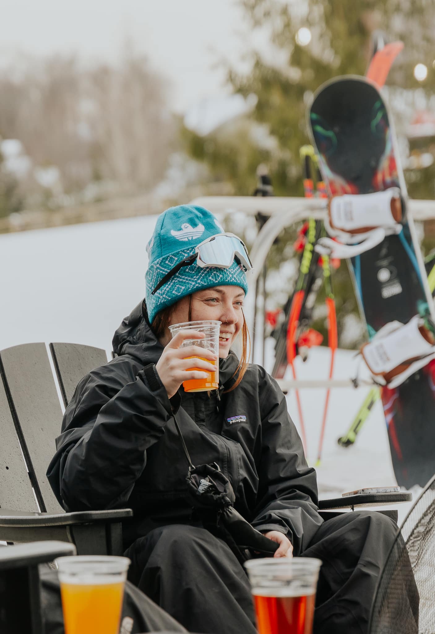 Young Adult woman enjoying a beer with friends at the BAR League
