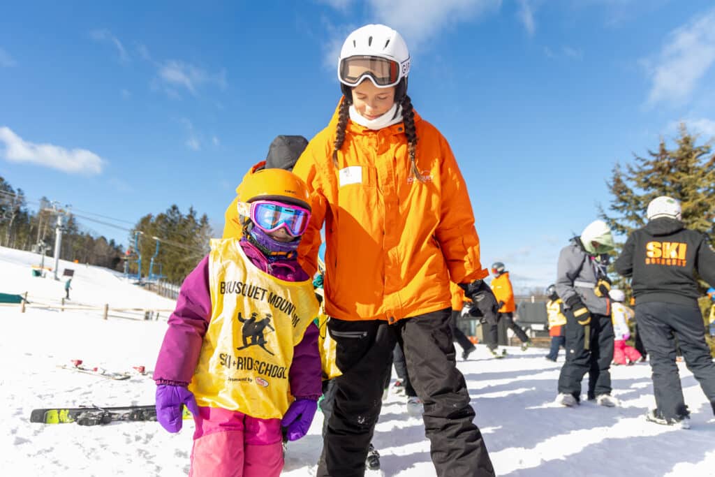 young girl taking a lesson at bousquet mountain